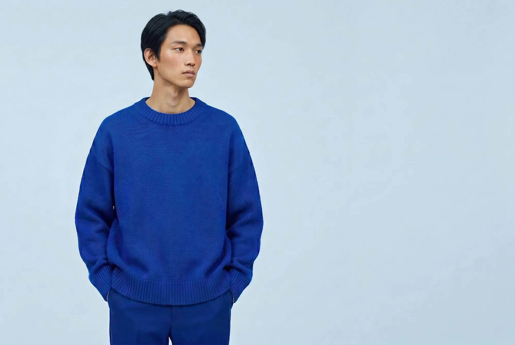Male model wearing a colourful knit sweater