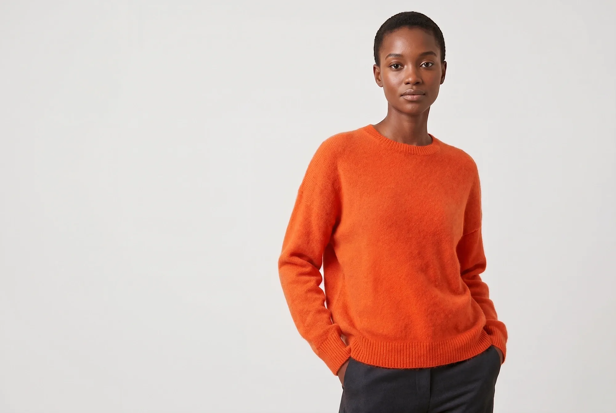 Model wearing a colourful knit sweater