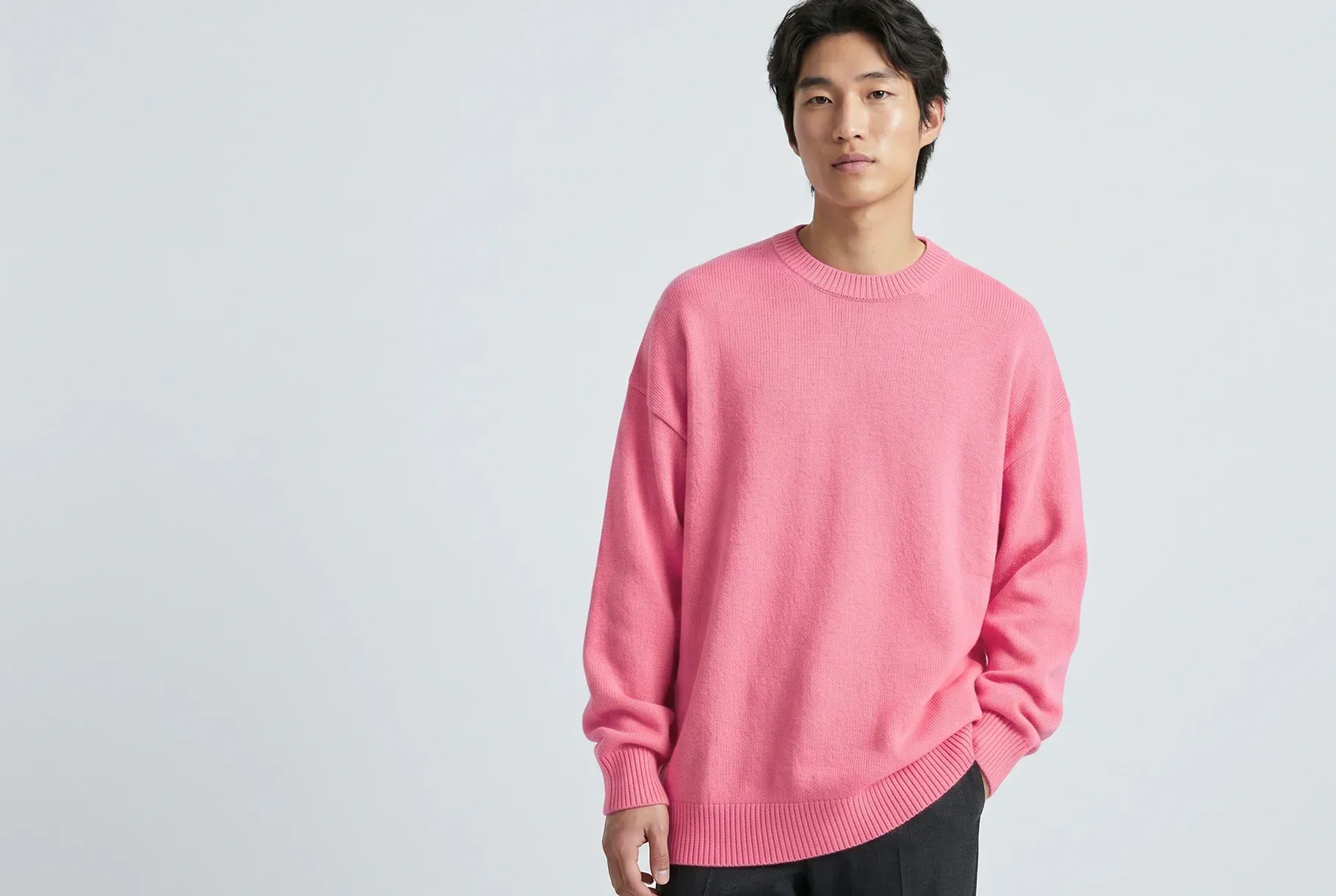 Male model wearing a colourful knit sweater